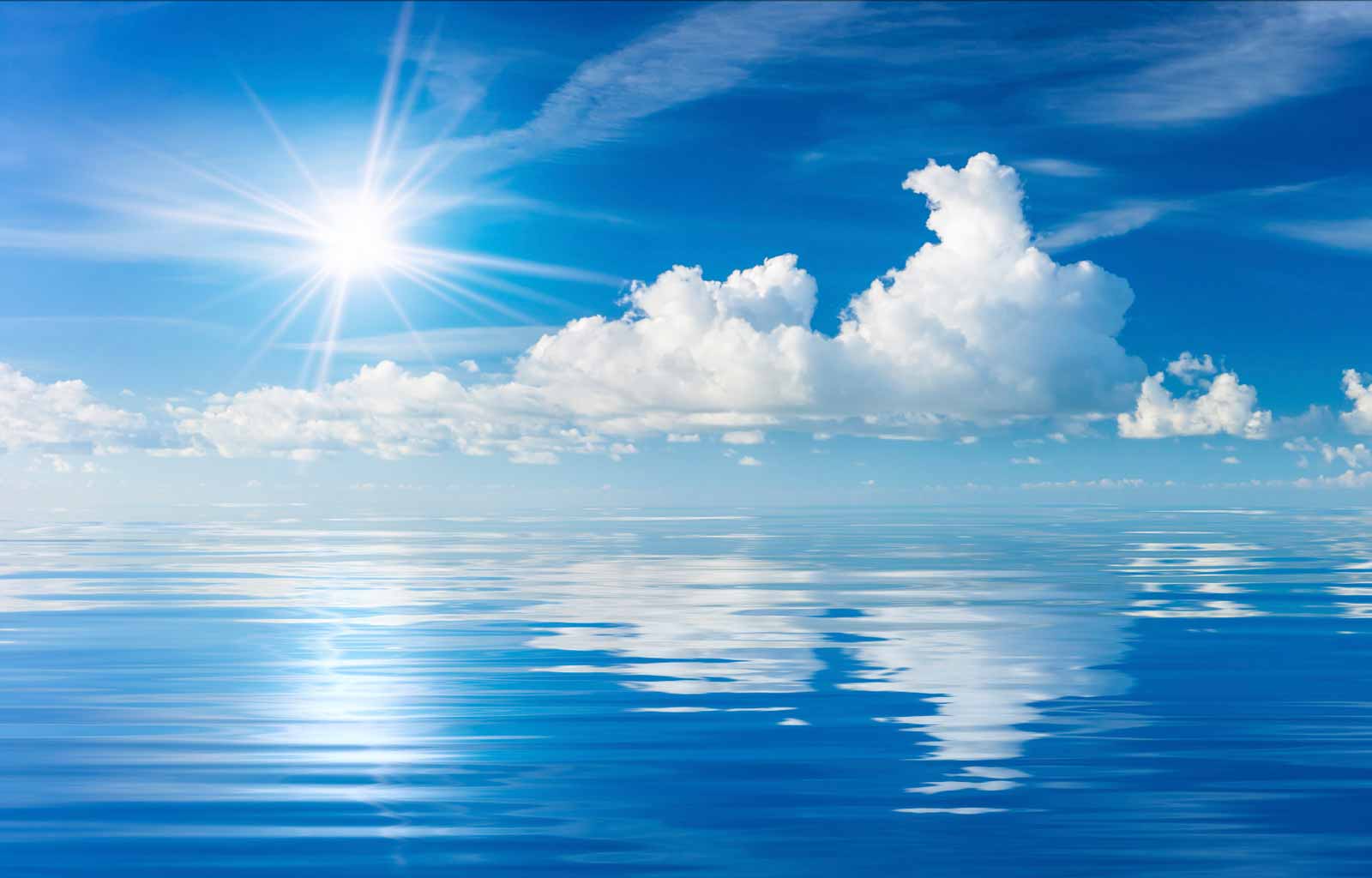 blue sky with clouds over ocean